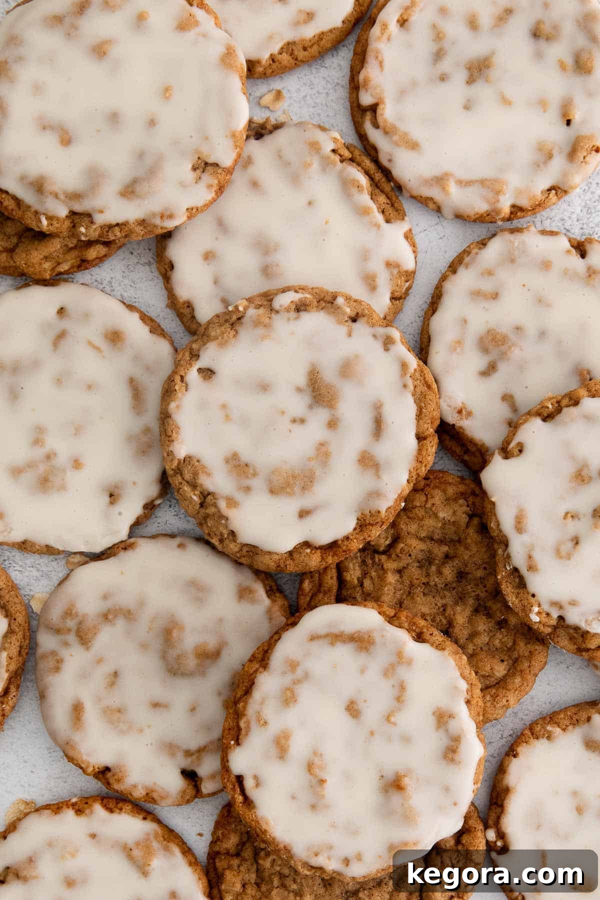 Irresistible Gluten-Free Iced Oatmeal Cookies 11 Close-up of a stack of perfect gluten-free oatmeal cookies with white icing.