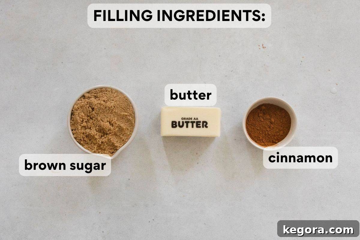 Irresistible Gluten-Free Cinnamon Swirl Wreath 5 The filling ingredients, brown sugar, ground cinnamon, and melted butter, are carefully measured and labeled, prepared for assembling the gluten-free cinnamon roll wreath.