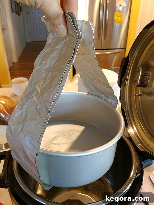 Aluminum foil sling lifting round pot out of pressure cooker
