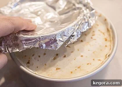 Effortless Instant Pot Taco Bake 8 Foil covering the taco pie in the pan