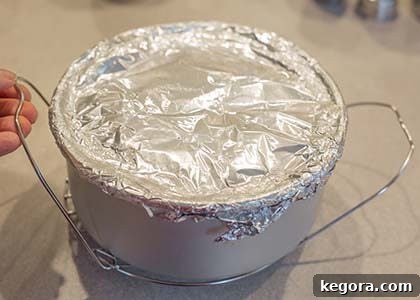 Effortless Instant Pot Taco Bake 9 Assembled taco pie pan on a trivet ready for the Instant Pot