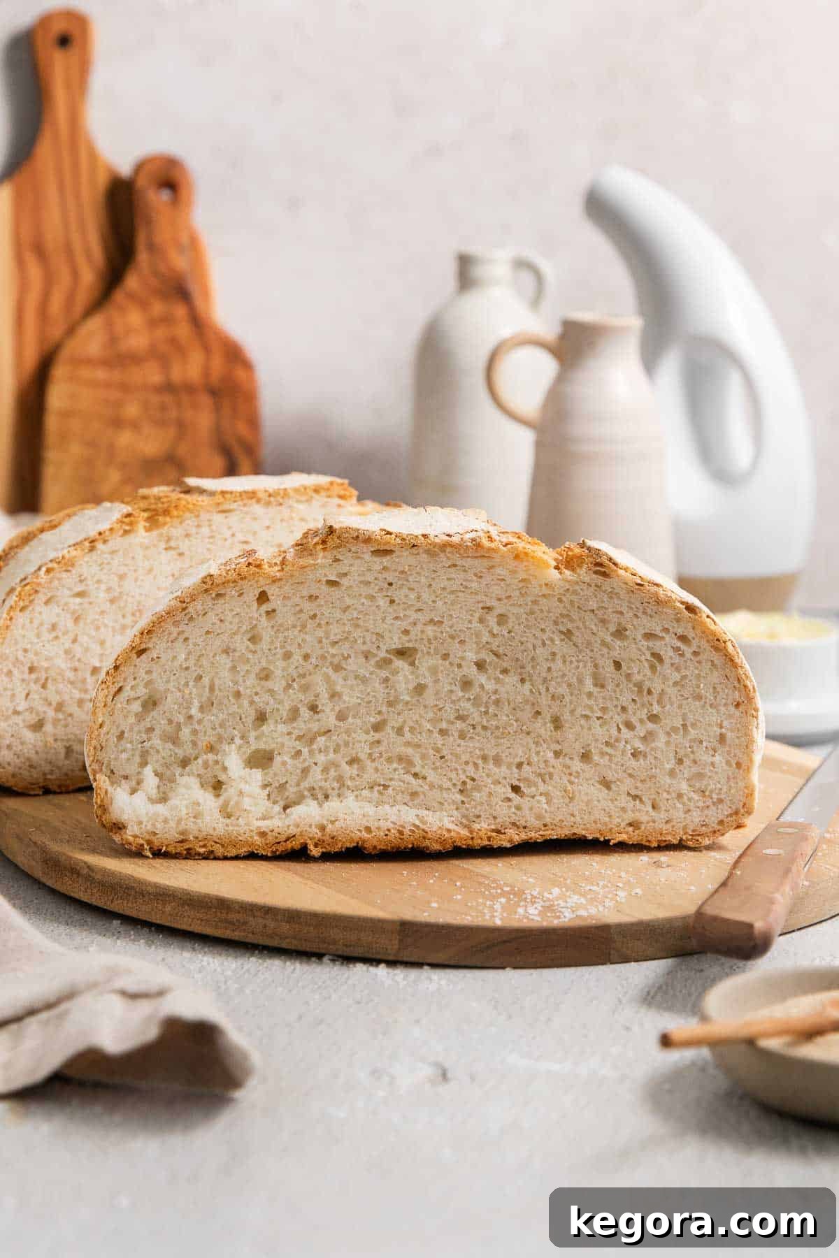 Close-up of freshly sliced artisan bread, revealing the airy, open crumb and porous interior, showcasing its perfect gluten-free structure.