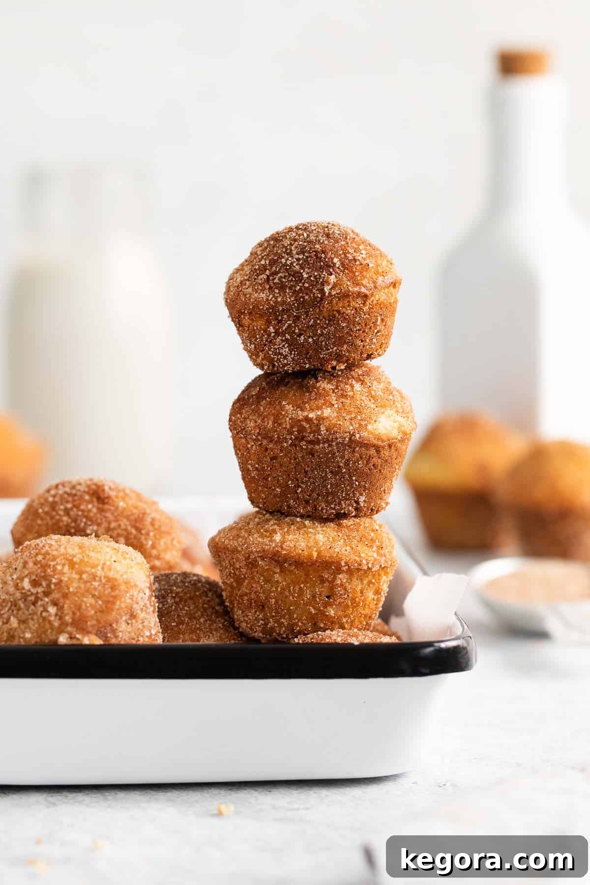 French breakfast puffs stacked on a plate, ready to be enjoyed.
