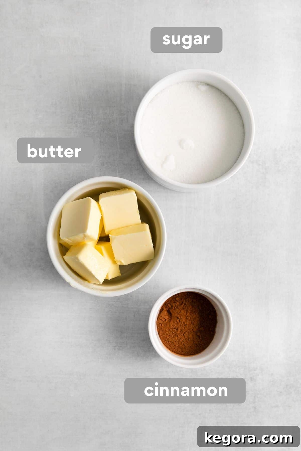 French breakfast puff topping ingredients, cinnamon sugar and butter, on a countertop.