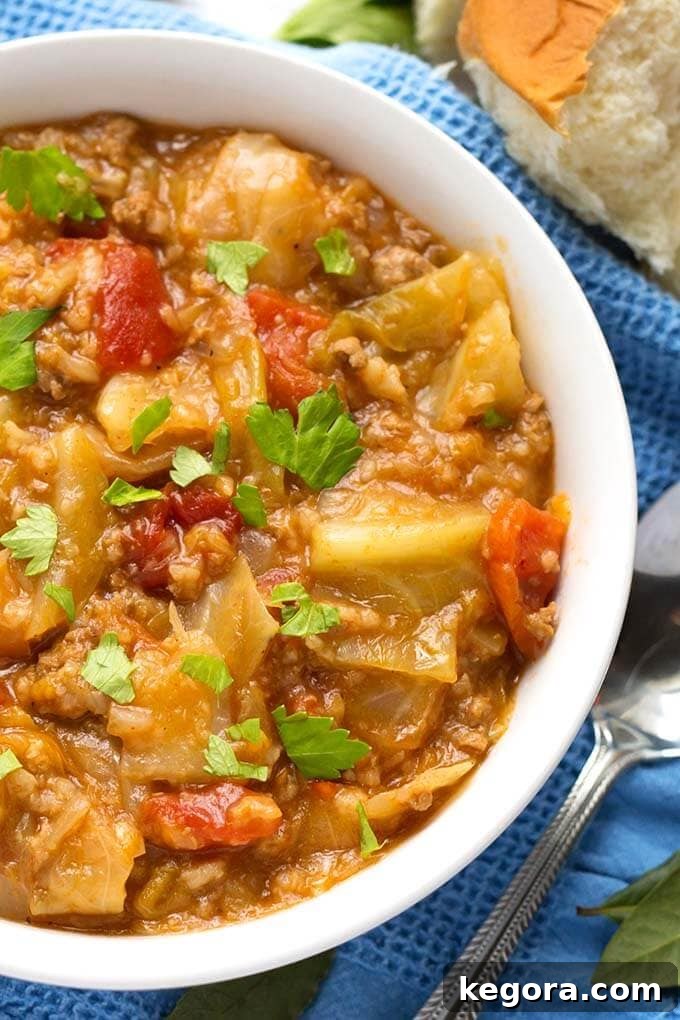 Close-up shot of Instant Pot Unstuffed Cabbage Rolls, showcasing the texture of the tender cabbage, ground meat, and rice in a rich tomato-based sauce.