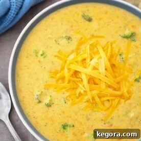 Instant Pot Broccoli Cheddar Soup is thick and cheesy with the right amount of broccoli. This pressure cooker broccoli cheddar soup is so delicious, you might need to make a double batch! simplyhappyfoodie.com #instantpotrecipes #instantpotsoup #instantpotbroccolicheddar #pressurecookerbroccolicheddarsoup
