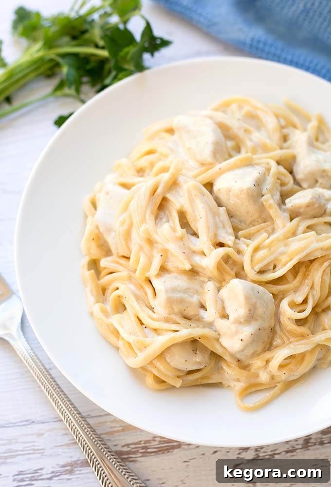 Instant Pot Fettuccine Alfredo with chicken on a white plate