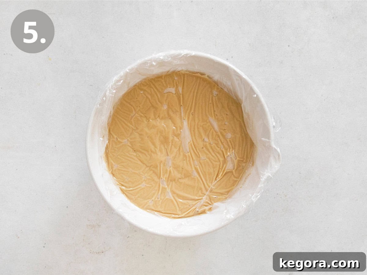The Finest Butterscotch Pudding 7 The final step: cooling the butterscotch pudding with plastic wrap pressed directly on the surface to prevent a skin from forming.