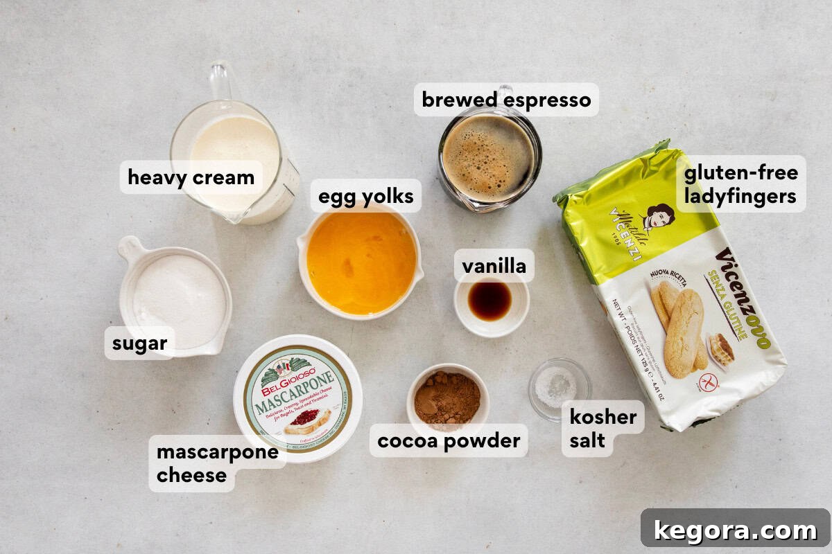 An array of fresh, high-quality ingredients laid out on a kitchen countertop, ready for making gluten-free tiramisu. This includes mascarpone cheese, eggs, ladyfingers, espresso, and cocoa powder.
