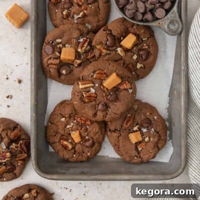 A close-up of delicious gluten-free chocolate turtle cookies in a baking pan, ready to be enjoyed.