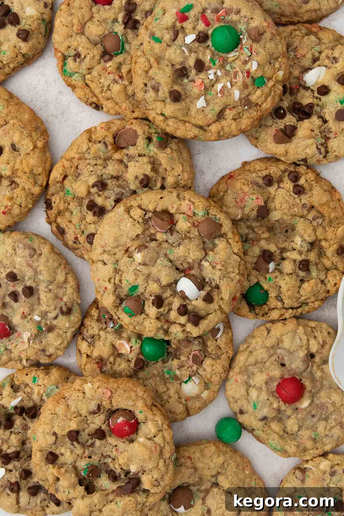 A stunning arrangement of baked Gluten-Free Cadbury Snowball cookies on a countertop, ready to be enjoyed, with festive holiday decorations nearby.
