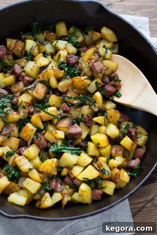 A close-up of the delicious Caramelized Shallot, Kale & Sausage Hash, showcasing its rich textures and inviting colors, a perfect gluten-free meal.