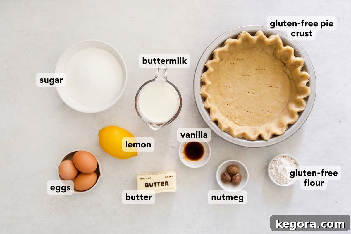 Southern Charm Gluten-Free Buttermilk Pie 4 Assorted ingredients for gluten-free buttermilk pie, including flour, butter, buttermilk, eggs, lemon, and nutmeg, laid out on a kitchen countertop.