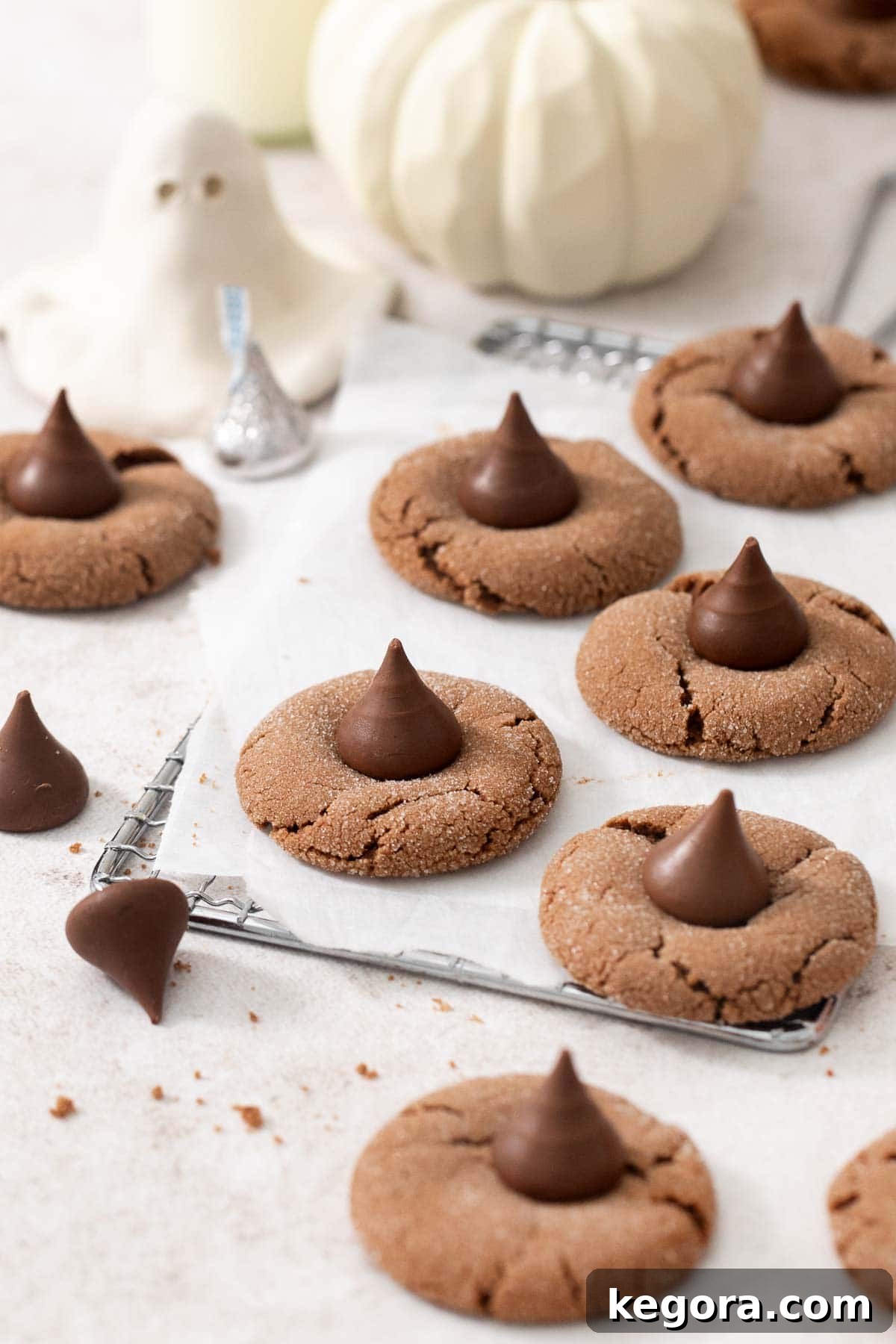 Delicious gluten-free Nutella witch hat cookies cooling on a wire rack, showcasing their perfect shape and chocolate tops.