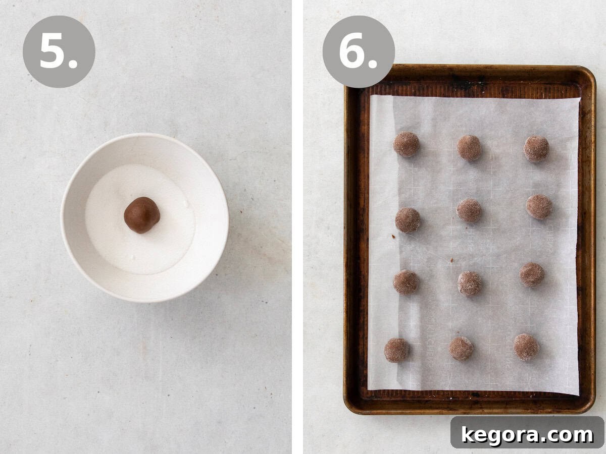 Gluten-free Nutella witch hat cookie dough balls, some rolled in sugar, arranged on a baking sheet before baking.