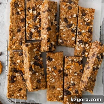 No-bake peanut butter oatmeal bars on a wire cooling rack with parchment paper