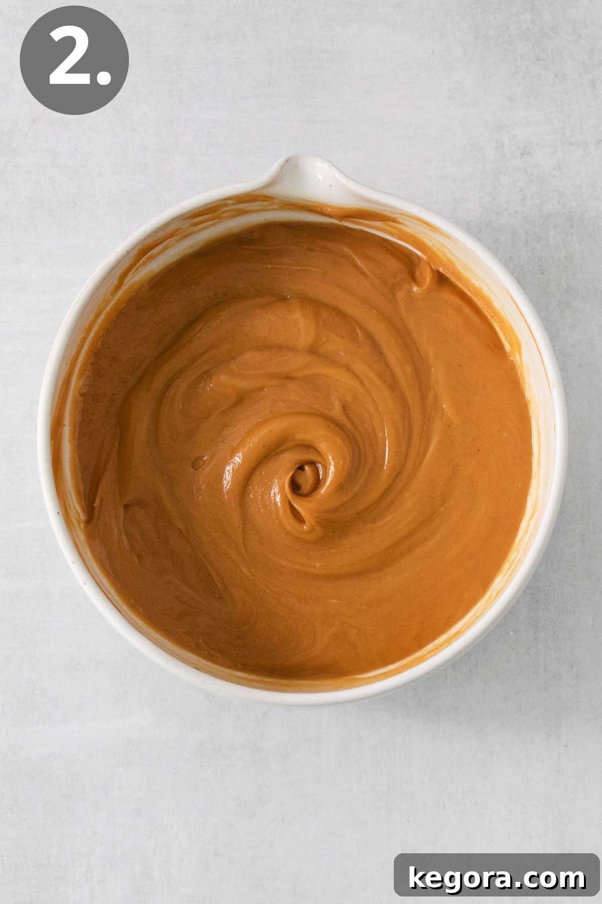 Smooth peanut butter and honey mixture in a separate bowl.