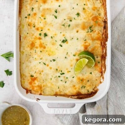 baking dish of green chili chicken enchiladas.
