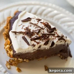 close up shot of chocolate pie on white plate