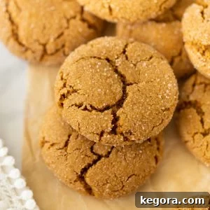 gluten-free molasses cookies up close on brown parchment paper