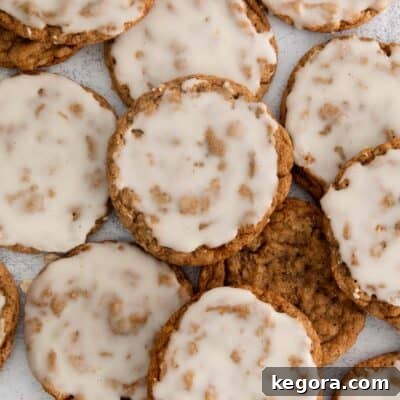 iced oatmeal cookies on a countertop.