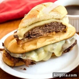 French Dip Sandwiches on a white plate