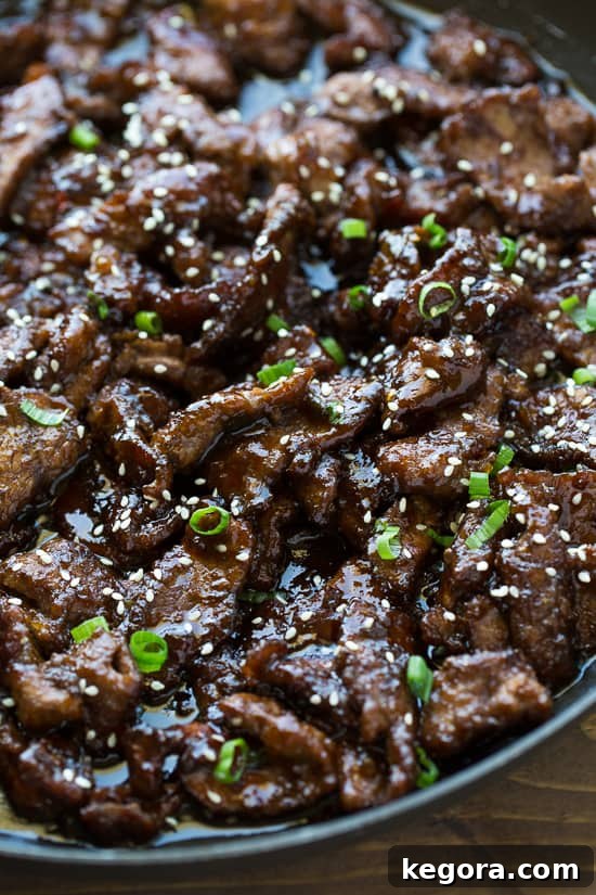 One-Pan Beef Teriyaki Beef teriyaki simmering in a skillet with the rich, glossy sauce