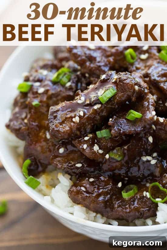 Best Beef Teriyaki Dinner Close-up shot of crispy beef teriyaki served generously over white rice, showcasing its inviting texture and glaze