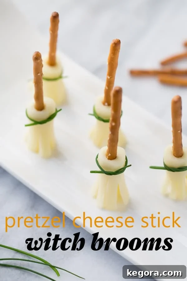 Spooktacularly Healthy Treats 6 Playful Pretzel Cheese Stick Witch Brooms neatly arranged on a white plate against a marble background.
