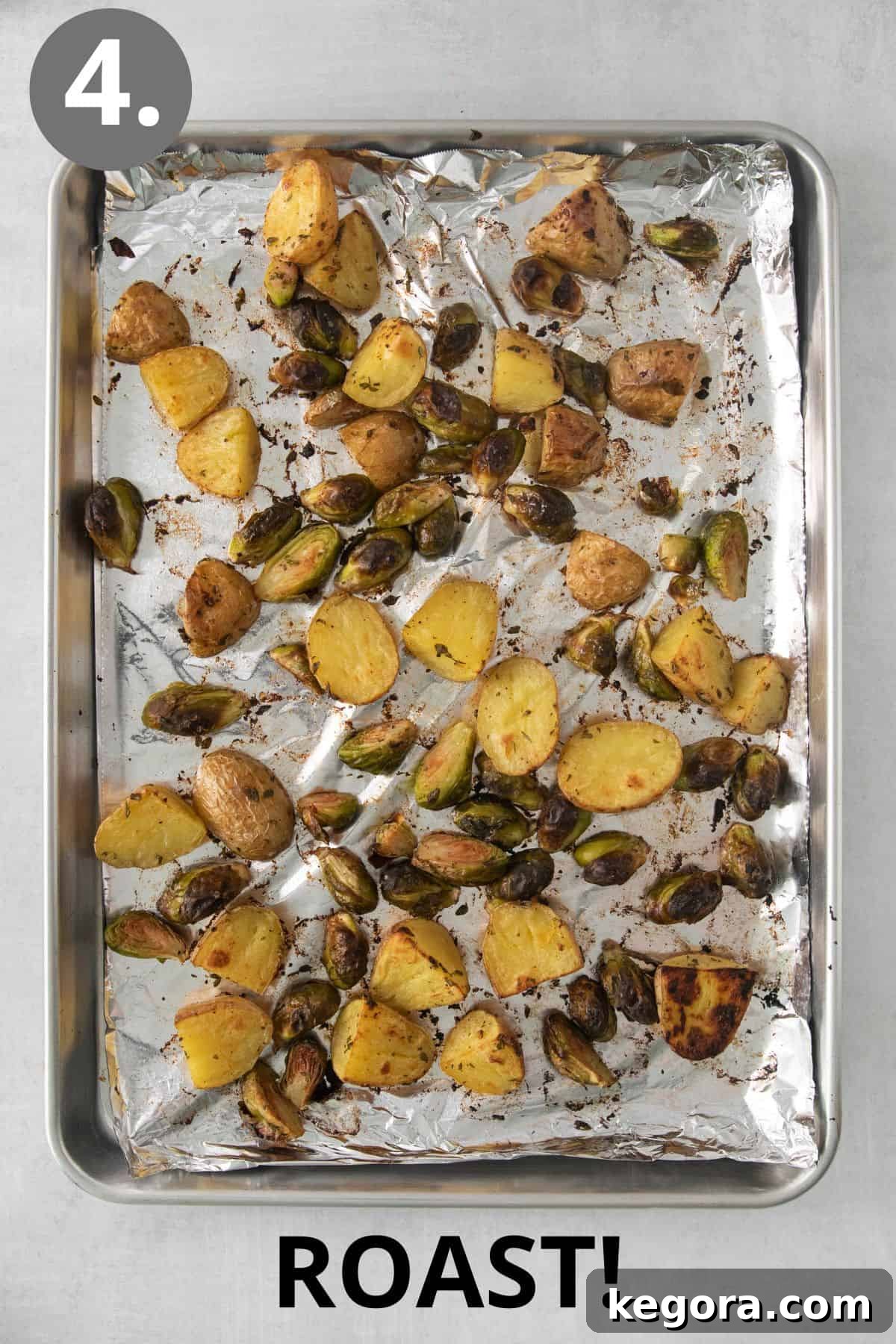 Golden Roast Potatoes with Crispy Brussels Sprouts 7 roasted brussel sprouts and potatoes on a baking sheet, golden and tender