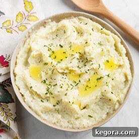 Instant Pot Creamy Cauli Mash 6 Mashed Cauliflower in a beige bowl