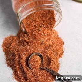 rotisserie chicken spice rub spilling out of small glass jar