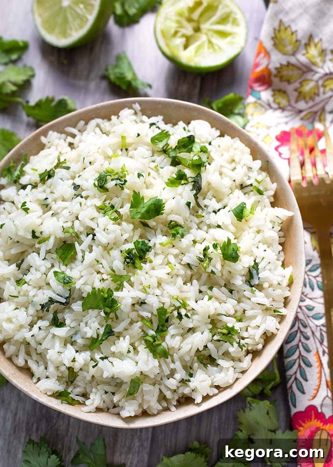 Cilantro Lime Rice in a beige bowl, showcasing its fluffy texture and vibrant green specks of cilantro.