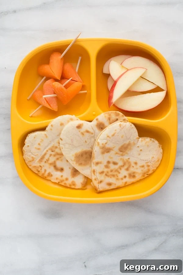 Heart quesadilla on an orange plate