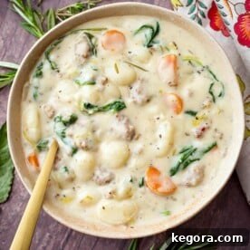 Creamy Sausage Gnocchi Soup in a beige bowl