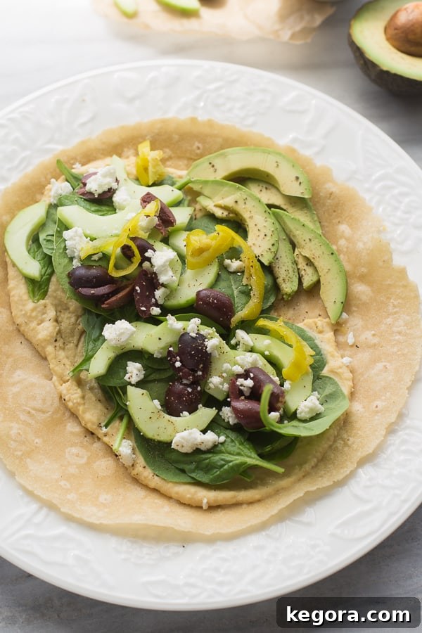Mediterranean Medley Hummus Wrap 2 healthy gluten free hummus wrap with cucumber, avocado, olives, spinach, and feta