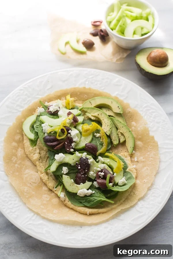Mediterranean Medley Hummus Wrap 6 corn tortilla with Mediterranean vegetables and hummus on it