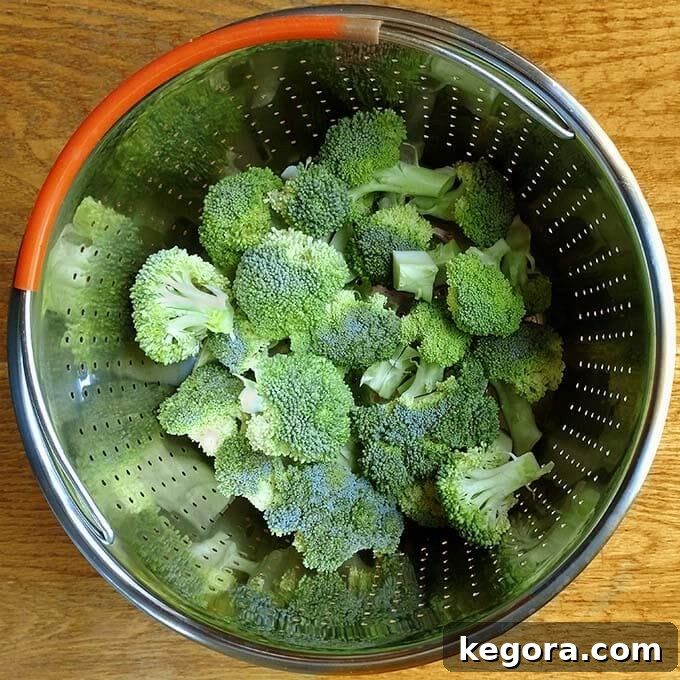 Perfect Instant Pot Broccoli 3 Raw Broccoli in a steamer basket