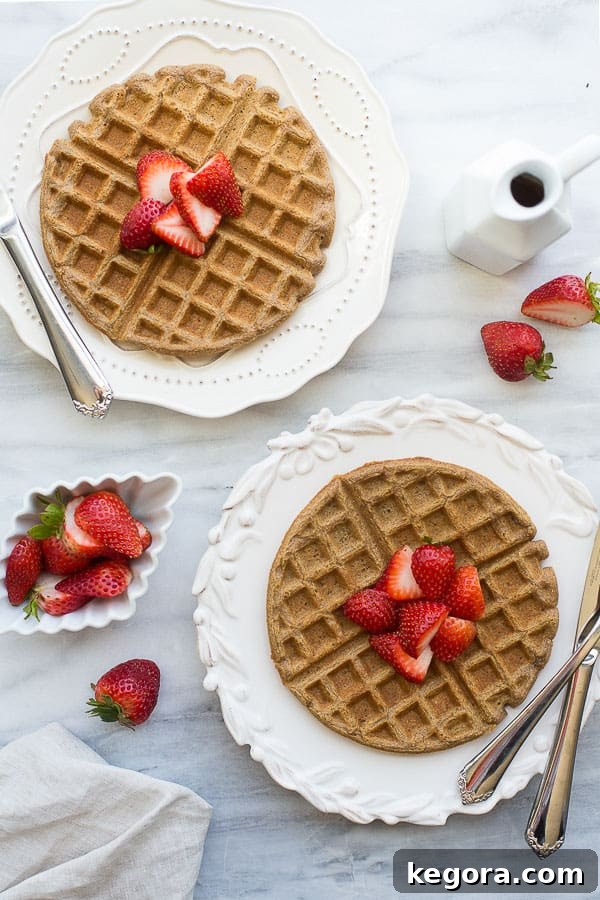 Buckwheat Waffles overhead shot of buckwheat waffles on white plates with strawberries
