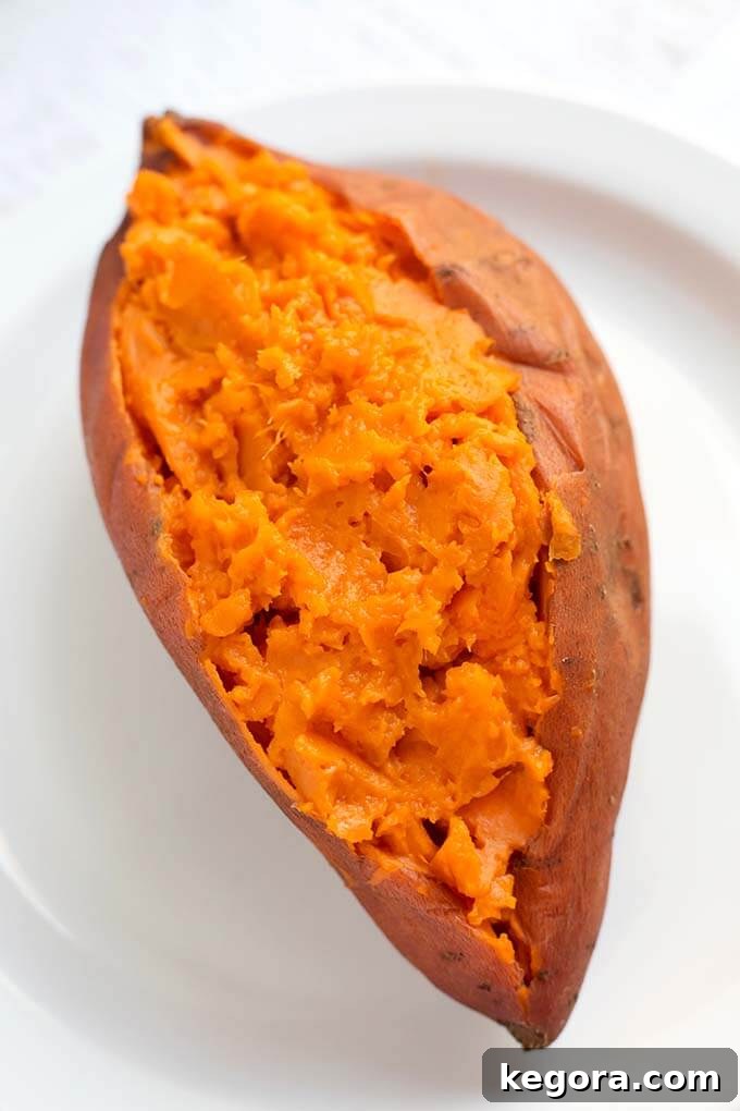 Cooked Sweet Potato on a white plate, ready to be topped