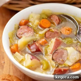 Instant Pot Kielbasa Cabbage Potato Soup in white bowl
