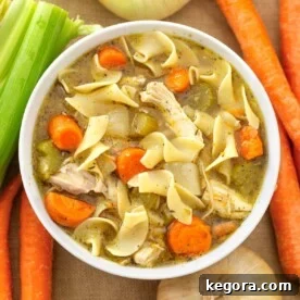 Instant Pot Chicken Noodle Soup in white bowl.
