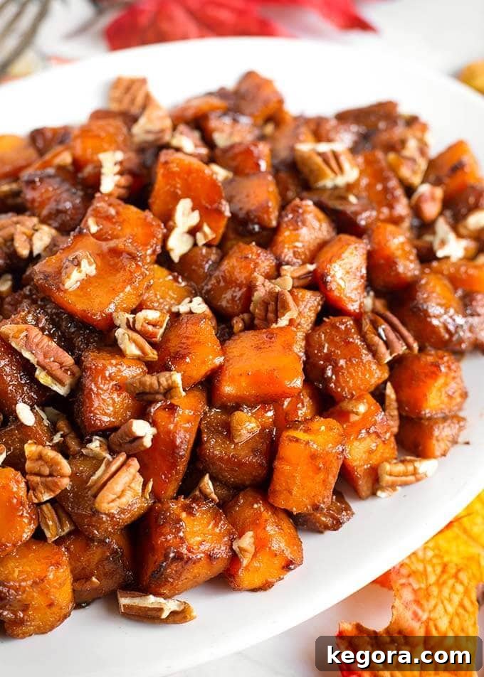 Maple Cinnamon Butternut Bliss 2 Cinnamon Roasted Butternut Squash elegantly arranged on a white oblong platter, ready to serve