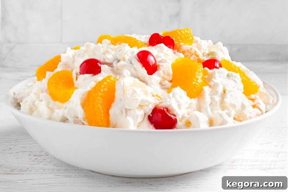Creamy Fruit Salad in a white bowl