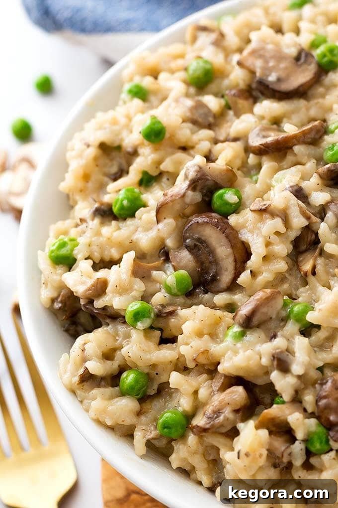Closeup of Mushroom Risotto with Peas on a white plate