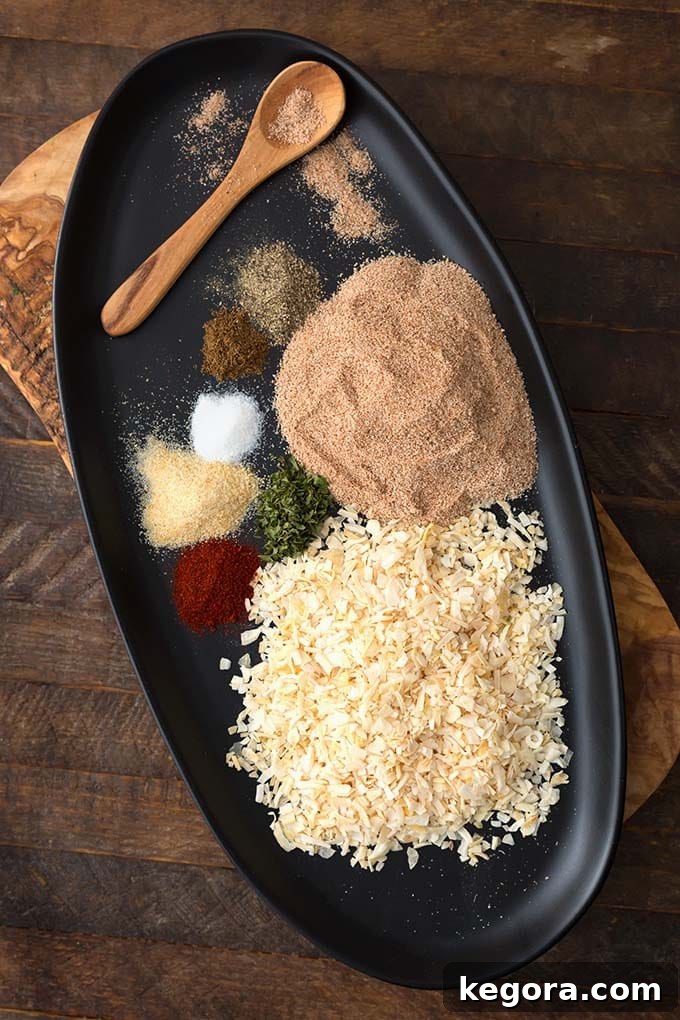 Ingredients for Homemade Onion Soup Mix on a black oblong platter