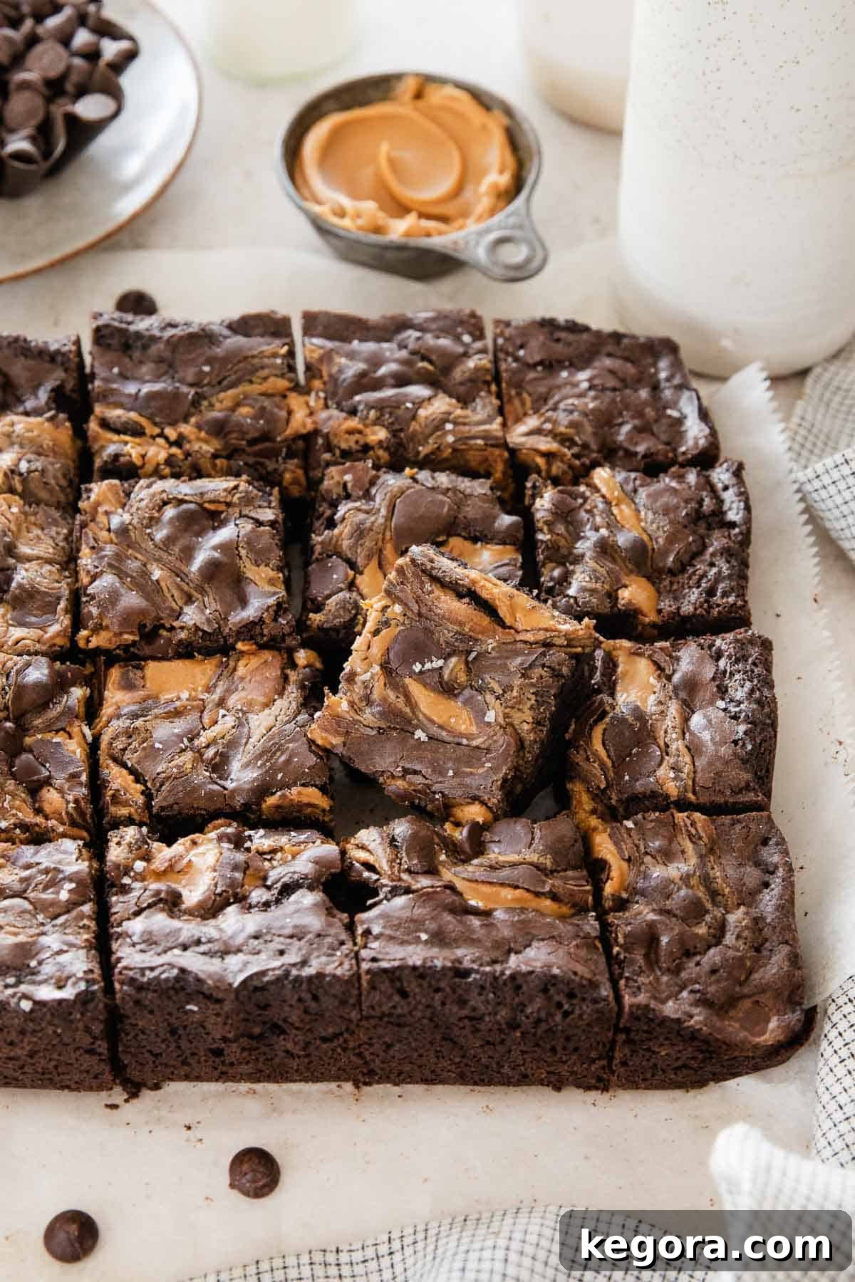 Gluten-free peanut butter brownies, neatly sliced and arranged on parchment paper, ready to be served.