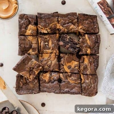 Gluten-free peanut butter brownies sliced on a piece of parchment.