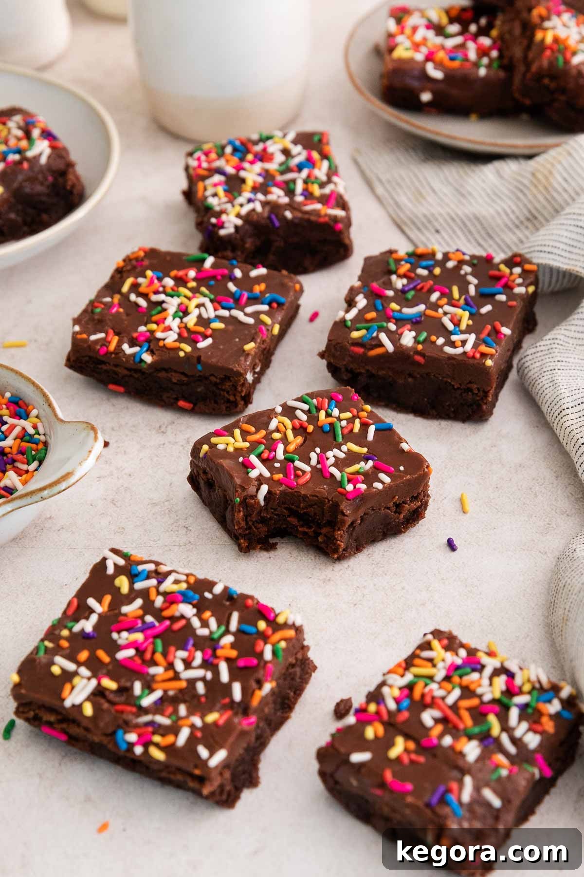 Delicious Gluten-Free Brownies for Birthday Celebrations 7 Birthday brownies on a counter with a bite missing from one.