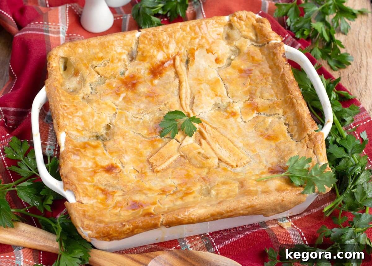 Classic Chicken Pot Pie with Flaky Butter Crust 9 chicken pot pie in white baking dish